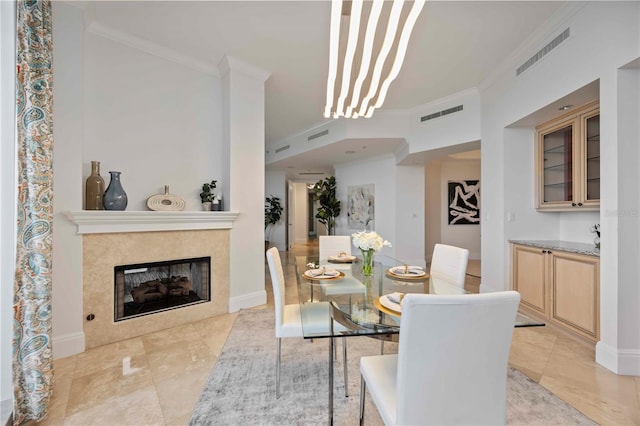 50 Central Ave Unit 17Phb, Sarasota, FL 34236 - dining room with crown molding, light tile patterned floors, and a fireplace