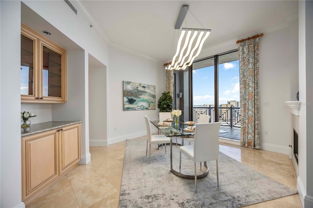 50 Central Ave Unit 17Phb, Sarasota, FL 34236 - dining area with ornamental molding and a chandelier