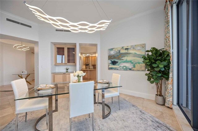 50 Central Ave Unit 17Phb, Sarasota, FL 34236 - dining space featuring crown molding and light tile patterned flooring