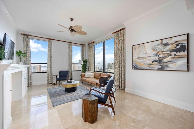 50 Central Ave Unit 17Phb, Sarasota, FL 34236 - living area with ornamental molding, a ceiling fan, healthy amount of natural light, and light tile patterned flooring