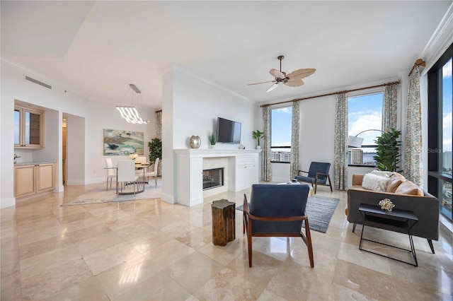 50 Central Ave Unit 17Phb, Sarasota, FL 34236 - living area featuring crown molding, a ceiling fan, and a high end fireplace