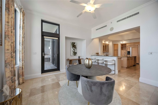50 Central Ave Unit 17Phb, Sarasota, FL 34236 - dining area with ornamental molding, ceiling fan, and light tile patterned floors