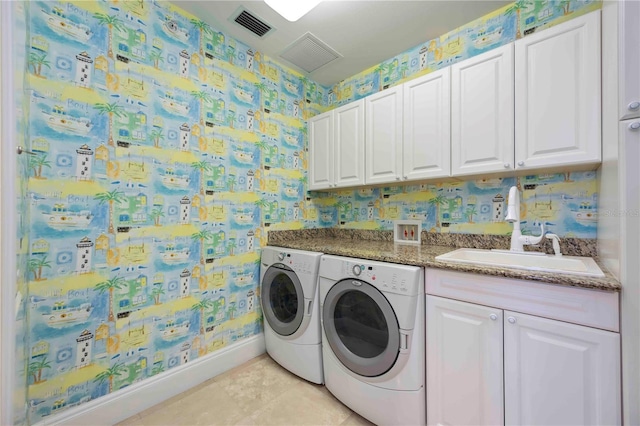 50 Central Ave Unit 17Phb, Sarasota, FL 34236 - laundry room with washing machine and clothes dryer, cabinet space, and wallpapered walls