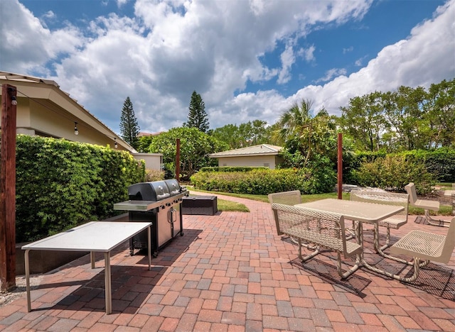 view of patio featuring a grill