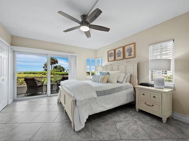 bedroom with access to exterior and ceiling fan