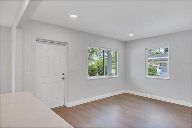 unfurnished bedroom with hardwood / wood-style floors and a closet