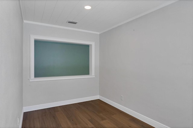 unfurnished room featuring ornamental molding and hardwood / wood-style flooring