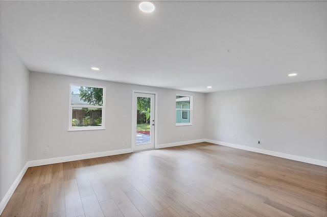 unfurnished room with light hardwood / wood-style flooring