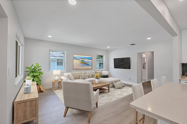 living room with light hardwood / wood-style flooring