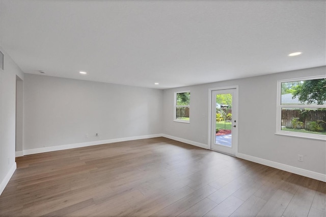 spare room featuring hardwood / wood-style floors