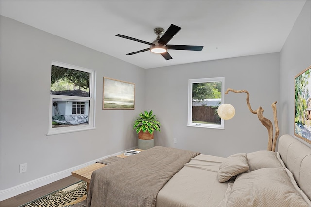 bedroom featuring ceiling fan and wood-type flooring