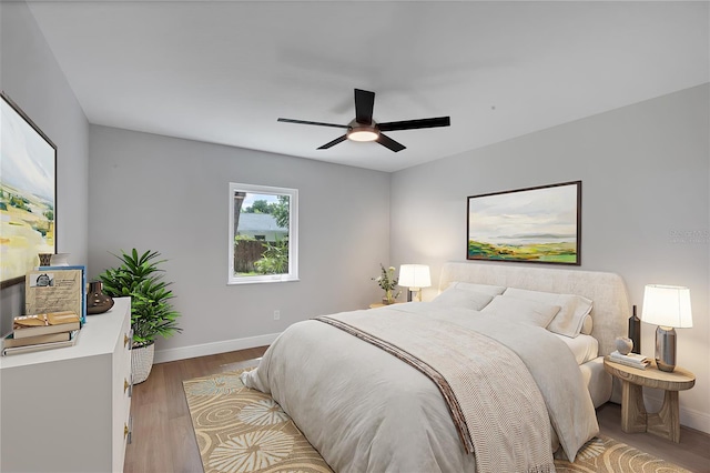 bedroom featuring ceiling fan and wood-type flooring