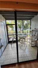 doorway to outside featuring a wealth of natural light and hardwood / wood-style flooring