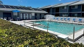 view of swimming pool featuring a patio