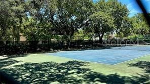view of tennis court with fence