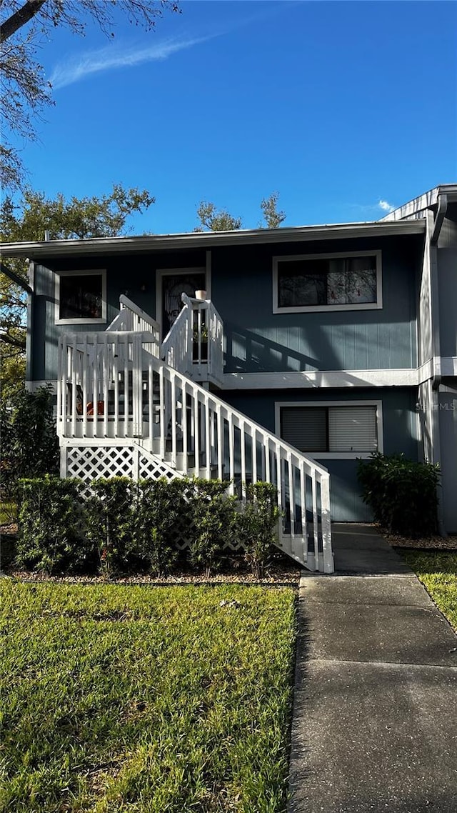 view of front facade with stairs and a garage