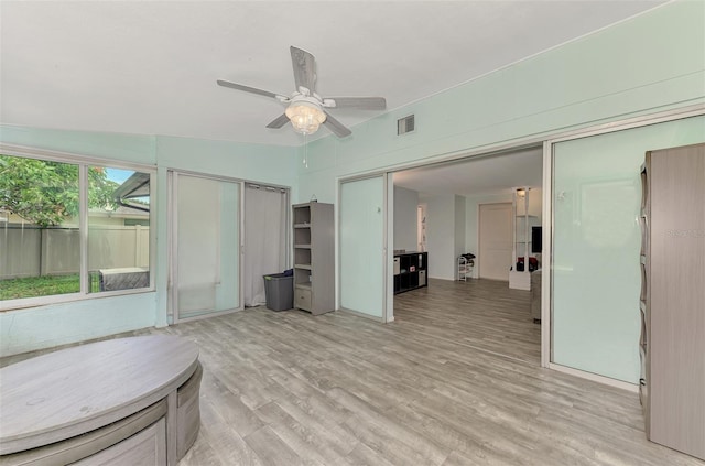 2900 Siesta Dr, Venice, FL 34293 - interior space featuring light wood-type flooring, visible vents, and a ceiling fan
