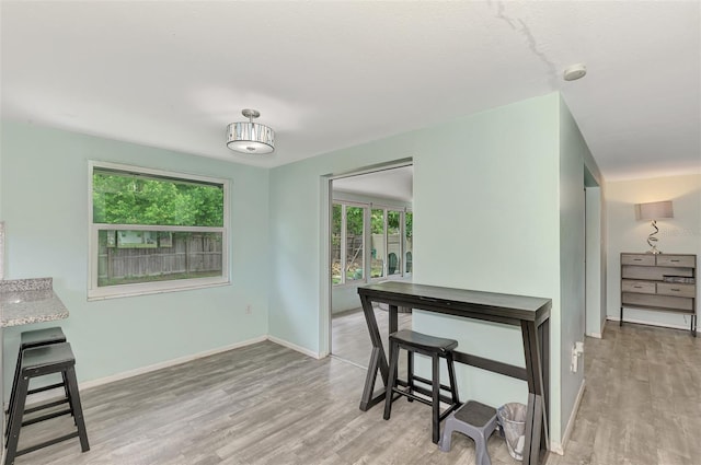 2900 Siesta Dr, Venice, FL 34293 - dining room featuring light wood-type flooring and baseboards