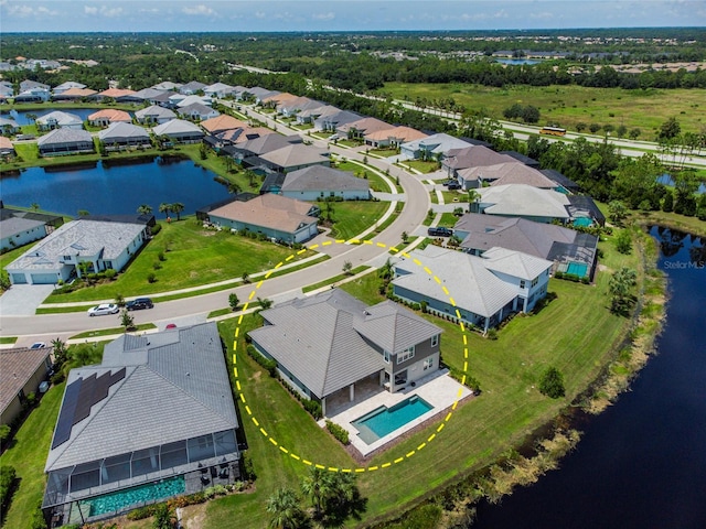 aerial view featuring a water view and a residential view