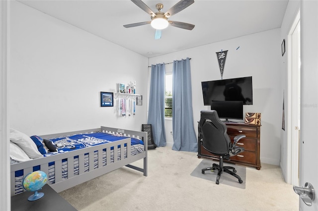 carpeted bedroom with ceiling fan