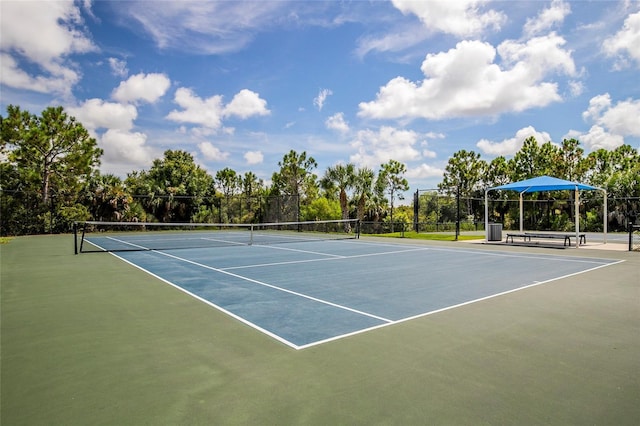 view of tennis court with fence