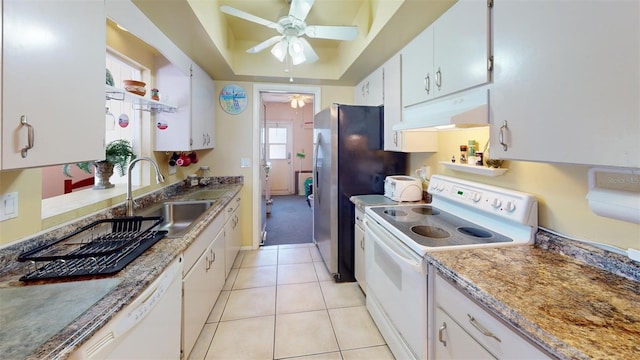 kitchen with ceiling fan, white cabinets, sink, light tile patterned flooring, and white appliances