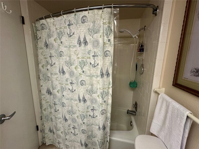 bathroom featuring shower / tub combo with curtain