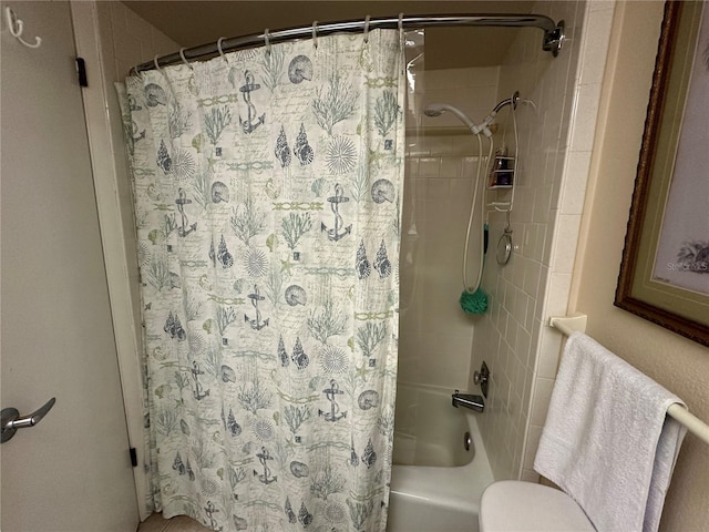 full bath featuring toilet and shower / bath combo with shower curtain