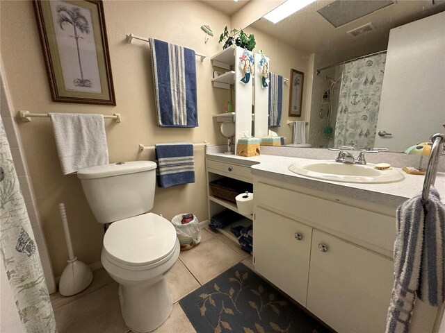 bathroom with tile patterned floors, vanity, and toilet