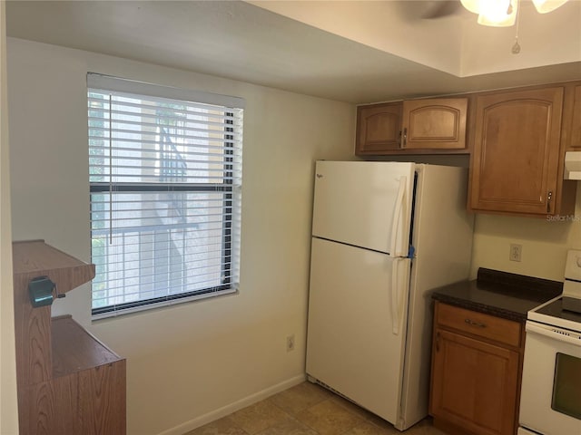 kitchen with white appliances, ceiling fan, and light tile patterned floors