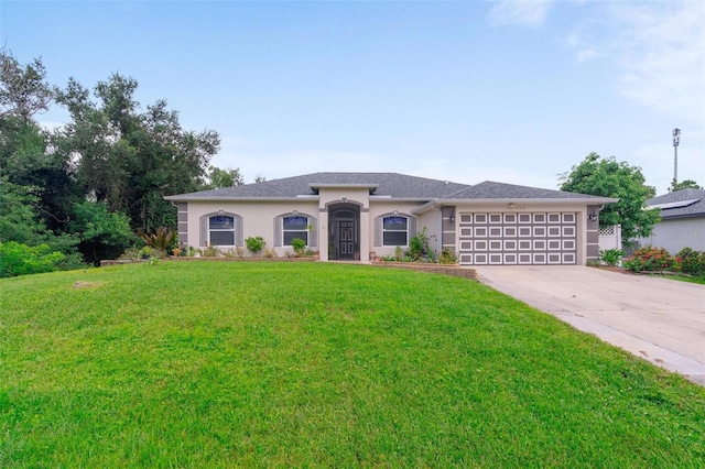 view of front of home with a garage and a front yard