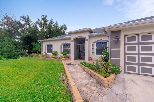 exterior space with a garage and a front yard