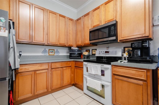 kitchen featuring light tile patterned floors, range with electric stovetop, and crown molding