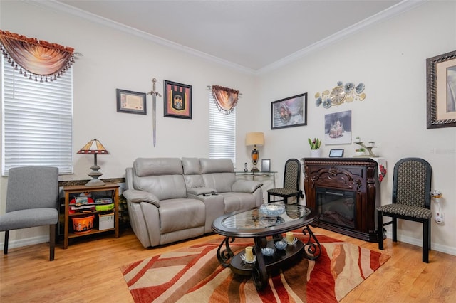 living room with light hardwood / wood-style flooring and ornamental molding