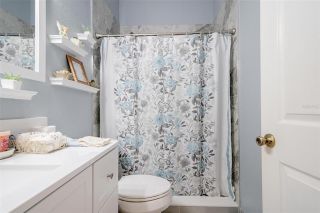 bathroom with tile patterned floors, vanity, and toilet