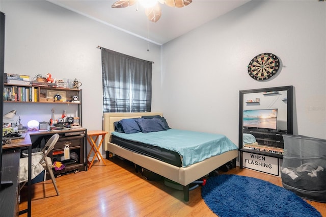 bedroom with ceiling fan and light hardwood / wood-style floors