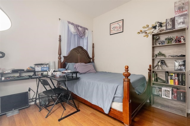 bedroom with light wood-type flooring