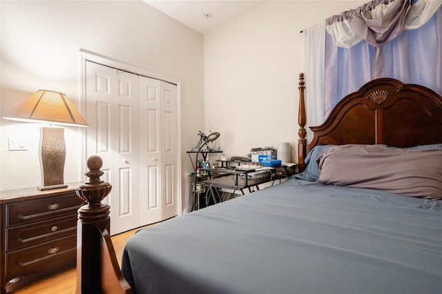 bedroom featuring a closet and light hardwood / wood-style flooring