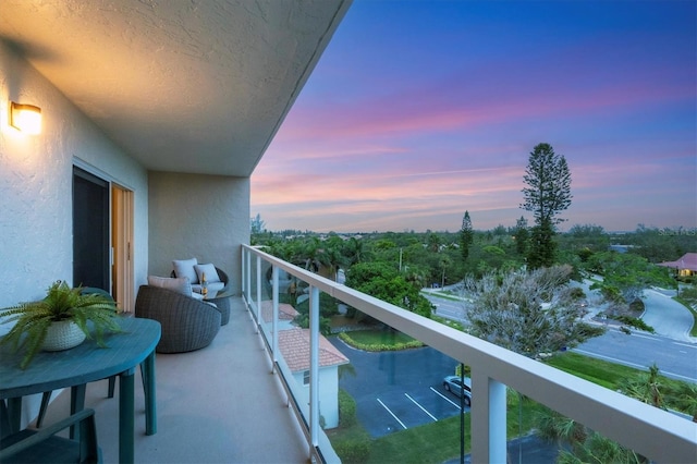 view of balcony at dusk