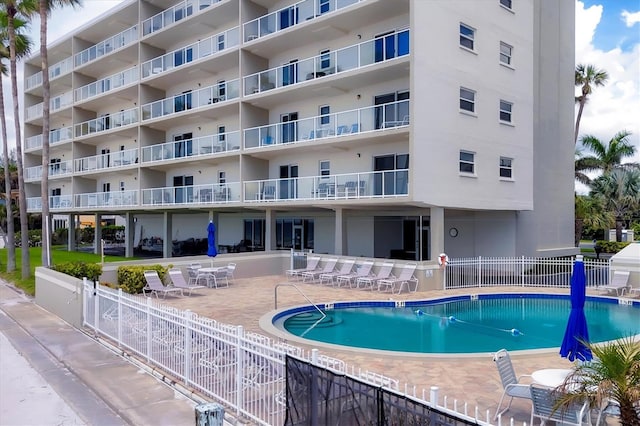 view of swimming pool featuring a patio