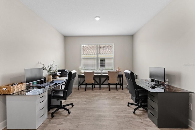 office area with light wood-type flooring