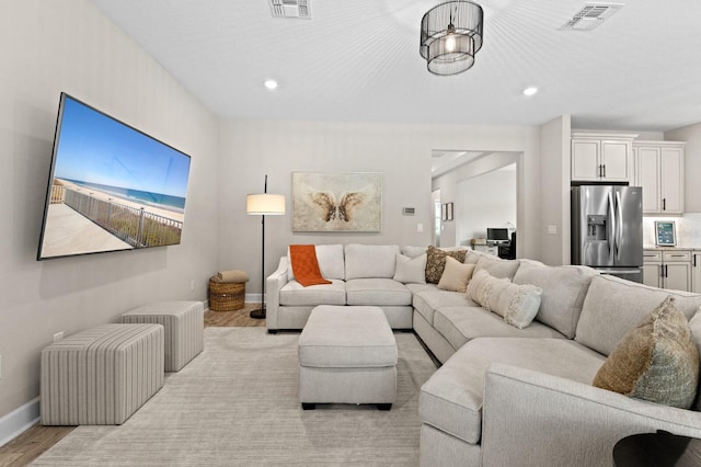 living room with light hardwood / wood-style flooring