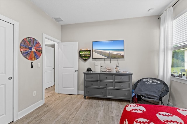 bedroom with light wood-type flooring