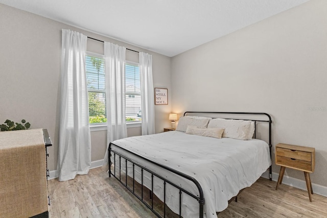 bedroom with light hardwood / wood-style flooring