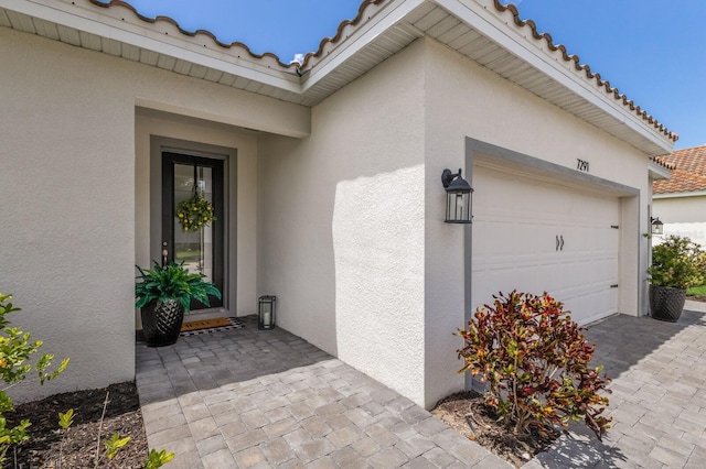 property entrance featuring a garage