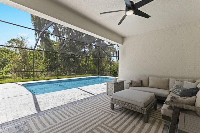 view of pool with a lanai, an outdoor hangout area, and a patio area