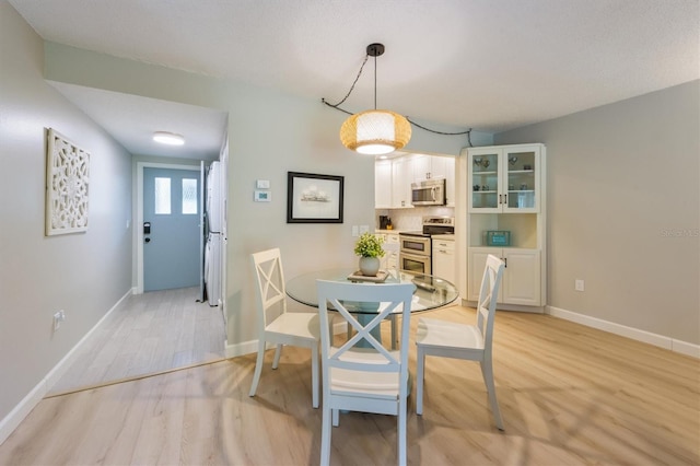 dining area with light wood-type flooring