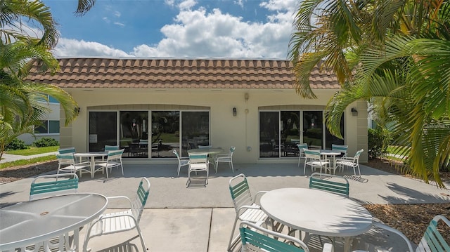 rear view of property featuring a patio