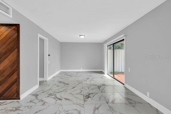1502 NE Buckeye Rd NE Unit 2, Winter Haven, FL 33881 - unfurnished room featuring marble finish floor, visible vents, and baseboards