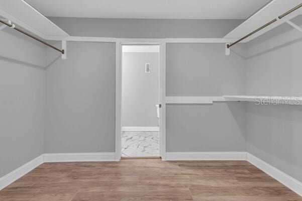 1502 NE Buckeye Rd NE Unit 2, Winter Haven, FL 33881 - spacious closet featuring wood finished floors